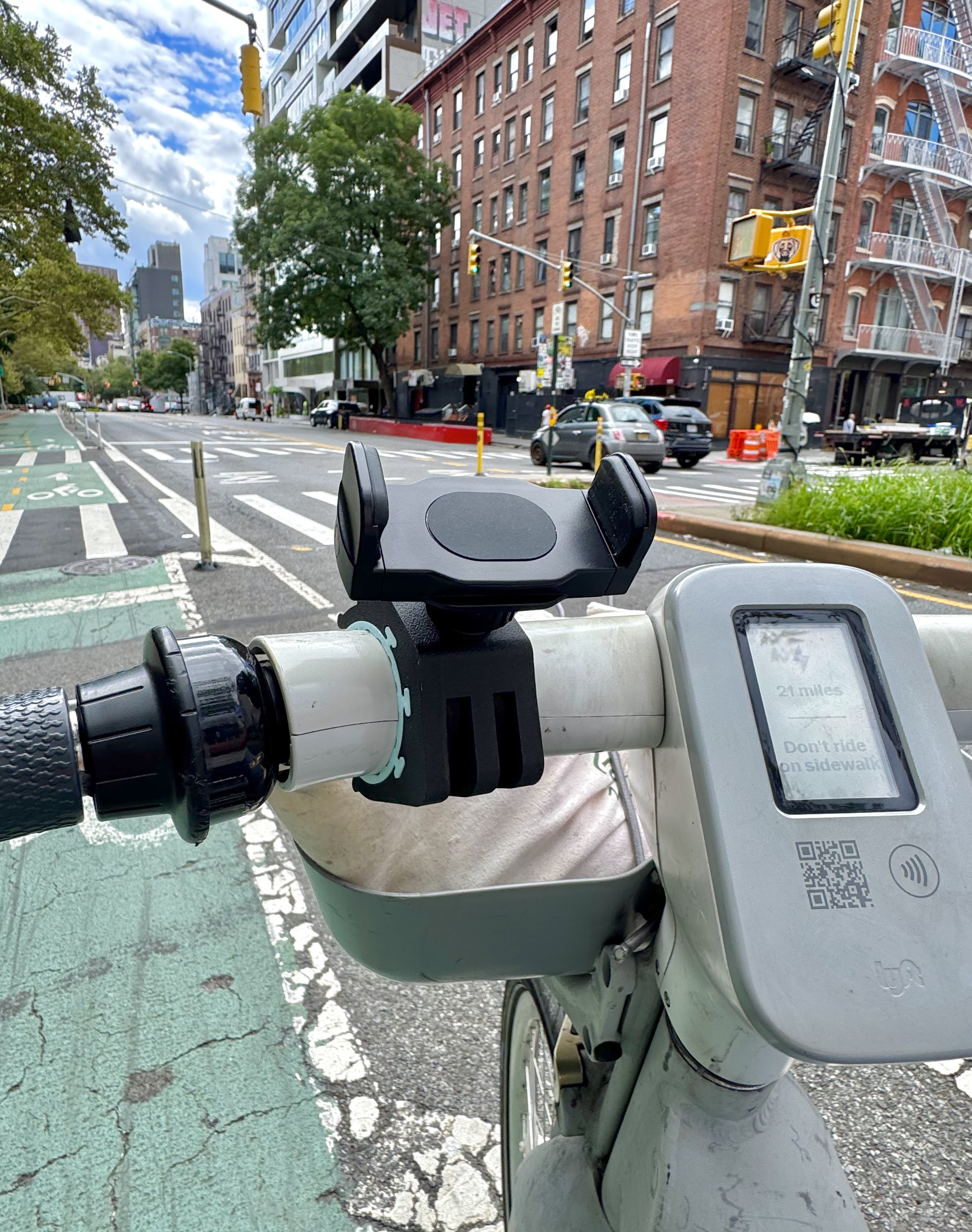 City Clip phone mount holding a phone with navigation on a Citi Bike handlebar in New York City